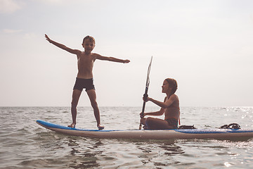 Image showing Happy children playing on the beach at the day time.