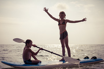 Image showing Happy children playing on the beach at the day time.