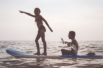 Image showing Happy children playing on the beach at the day time.