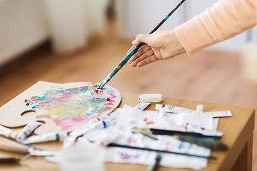 Image showing artist hand with paintbrush and color palette