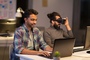 Image showing creative man with laptop working at office