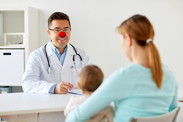 Image showing baby with mother at doctor on red nose day