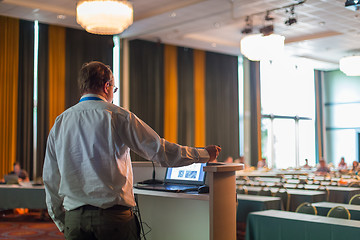 Image showing Public speaker giving talk at business event.