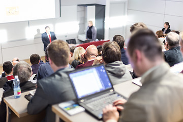 Image showing Business speaker giving a talk at business conference event.