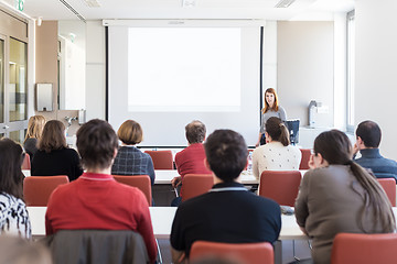 Image showing Woman giving presentation in lecture hall at university.