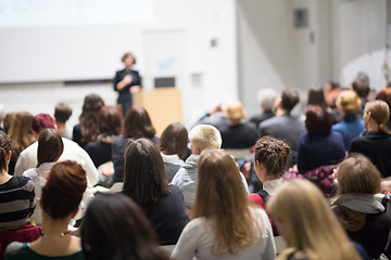 Image showing Woman giving presentation in lecture hall at university.