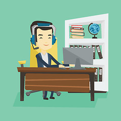 Image showing Business man with headset working at office.