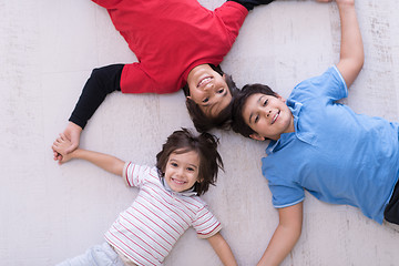 Image showing young boys having fun on the floor