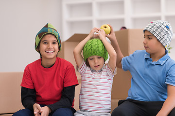 Image showing boys with cardboard boxes around them