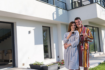 Image showing Young beautiful couple in bathrobes