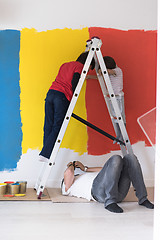 Image showing boys painting wall