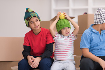 Image showing boys with cardboard boxes around them