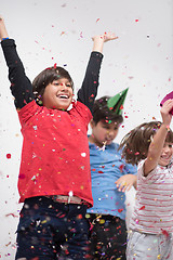 Image showing kids  blowing confetti