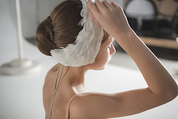 Image showing Beautiful little ballerina wearing a white swan bandage on her head