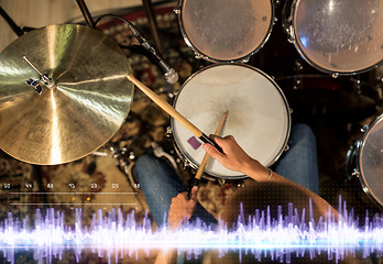 Image showing drummer playing drum kit at sound recording studio