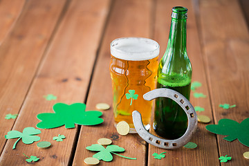 Image showing glass of green beer, horseshoe and gold coins