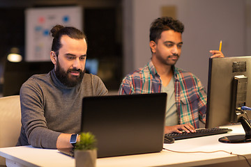 Image showing creative team with computer working late at office