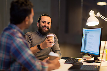 Image showing creative team drinking coffee at night office