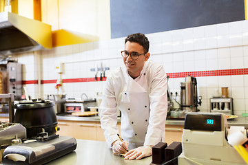 Image showing happy chef at kebab shop or fast food restaurant