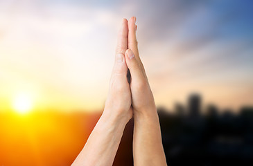 Image showing close up of senior and young woman touching hands