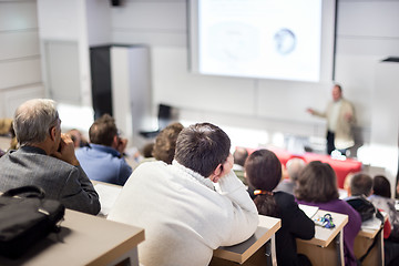 Image showing Business speaker giving a talk at business conference event.