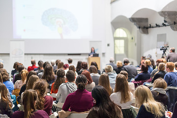 Image showing Woman giving presentation in lecture hall at university.