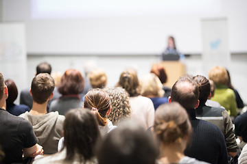 Image showing Woman giving presentation in lecture hall at university.