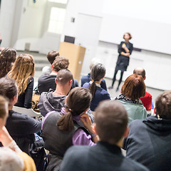 Image showing Woman giving presentation in lecture hall at university.