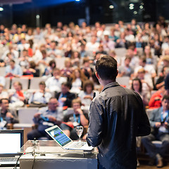 Image showing Public speaker giving talk at Business Event.