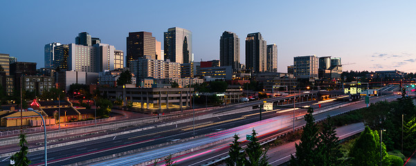 Image showing Early Morning Commuters Create Light Trails Before Rush Hour in 