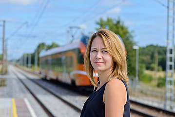 Image showing Female waiting train on the platform