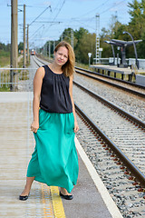 Image showing Walking girl on platform