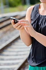 Image showing Closeup of woman hands using phone