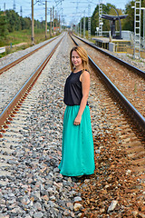 Image showing Standing girl between two railway path