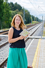 Image showing Female waiting train on the platform