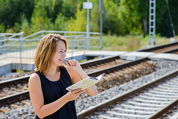 Image showing Female waiting train on the platform