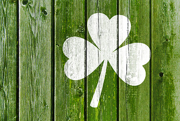 Image showing shamrock silhouette on old green wooden boards