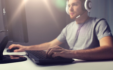 Image showing close up of man playing computer video game