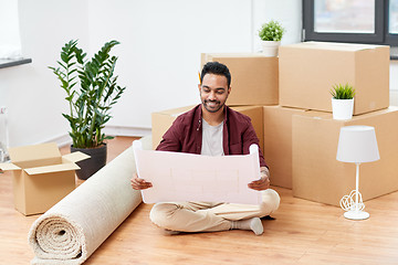 Image showing man with boxes and blueprint moving to new home