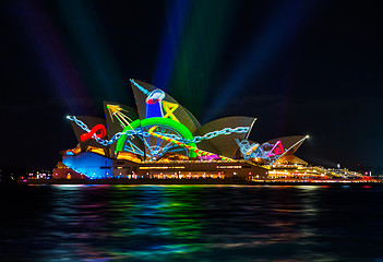 Image showing Sydney Opera House illuminated with vibrant moving graphics