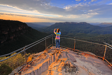 Image showing Capturing a photo of sunrise mountain lookout