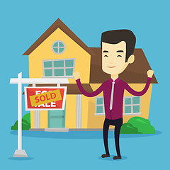 Image showing Real estate agent with sold placard.