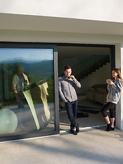 Image showing couple enjoying on the door of their luxury home villa