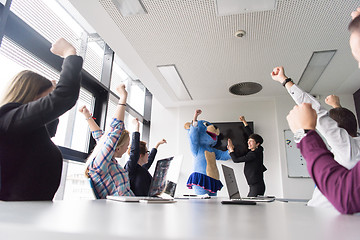 Image showing boss dresed as bear having fun with business people in trendy of