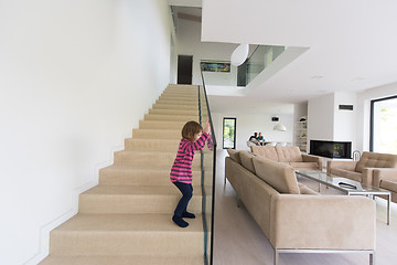 Image showing family with little girl enjoys in the modern living room