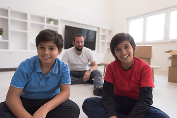 Image showing portrait of happy young boys with their dad