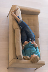 Image showing woman on sofa using tablet computer