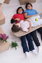 Image showing boys with cardboard boxes around them top view