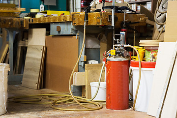 Image showing glue gun with pump or compressor at workshop