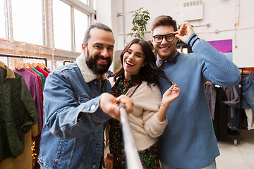 Image showing friends taking selfie at vintage clothing store